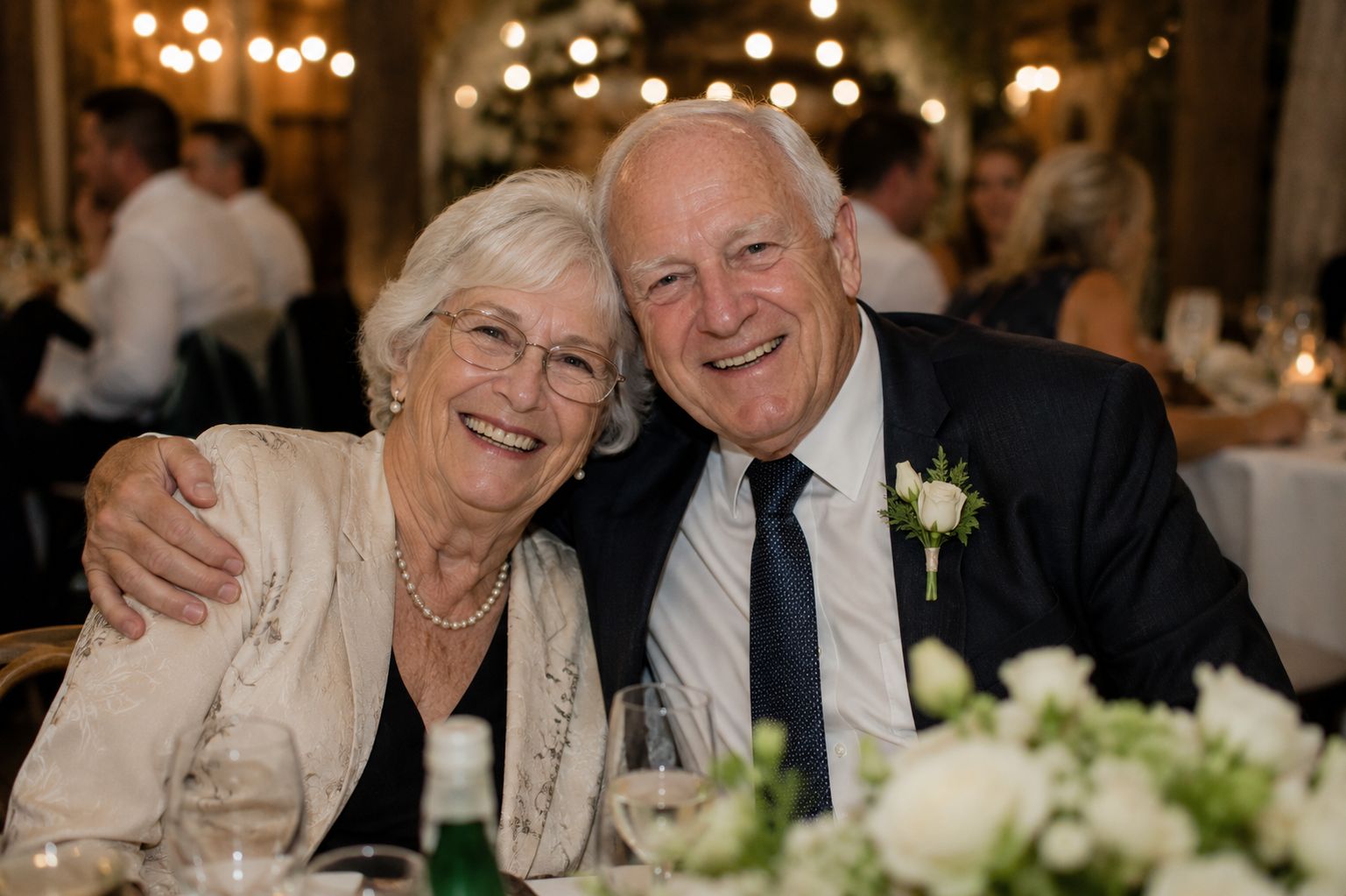 Grandparents smiling together at the reception
